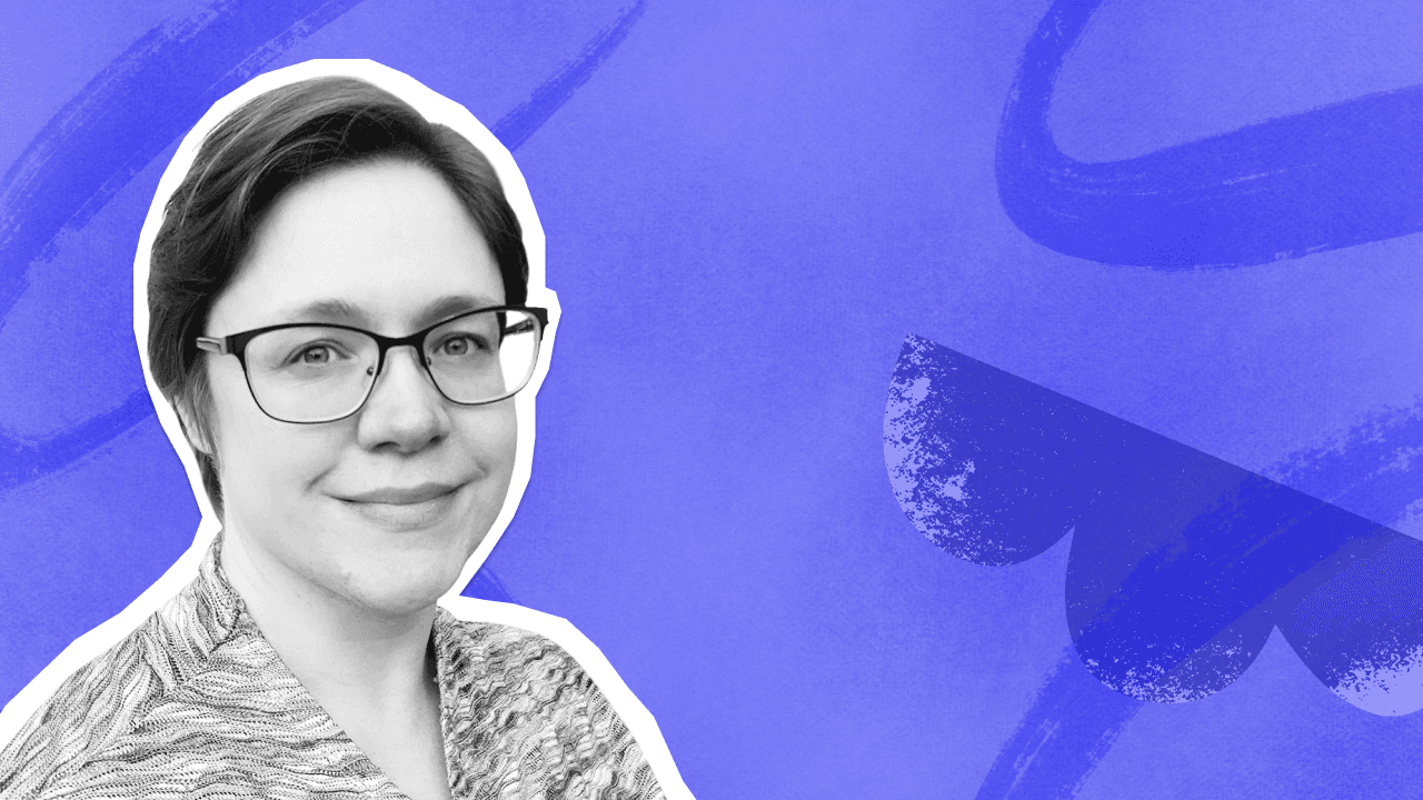 A smiling woman with short dark hair and glasses, wearing a patterned top, against a textured blue Birdie background.