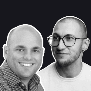 Two smiling Birdie team members, one in a checkered shirt and the other in glasses, against a dark background.