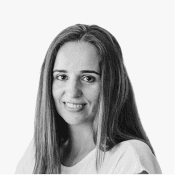 A young woman with long, straight hair smiles warmly, her expression conveying approachability and professionalism.