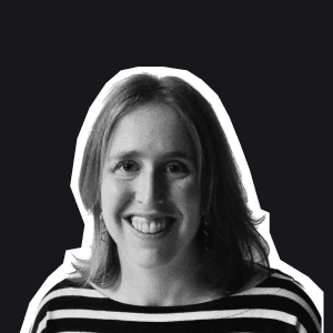 Smiling woman with shoulder-length hair and a striped top, her friendly gaze welcoming users to Birdie's support labs.