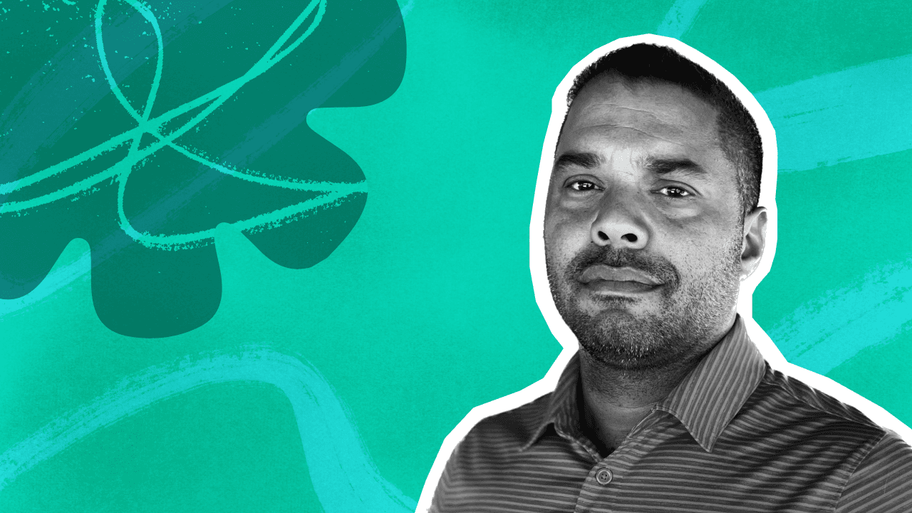 A smiling man in a striped shirt, rendered in black and white, against a vibrant teal and turquoise abstract background.