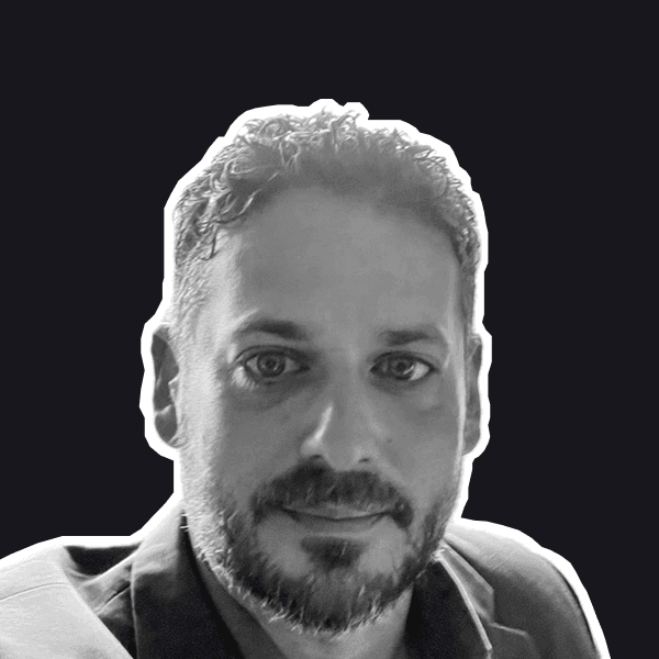 A professional man with a neatly trimmed beard and curly hair looks directly at the viewer, rendered in a striking black.